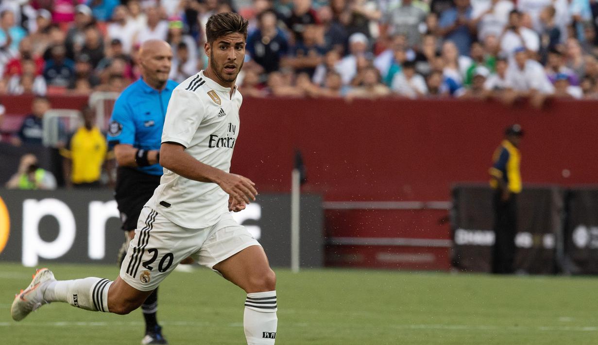 Asensio sudah melakoni 34 laga namun hanya menciptakan enam gol saja. Liverpool dan Tottenham Hotspur dikabarkan tertarik menggaet sang pemain pada transfer musim panas nanti. (AFP/Nicholas Kamm)