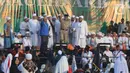 Gubernur DKI Jakarta Anies Baswedan saat menghadiri Munajat dan Maulid Akbar 2019 #ReuniMujahid212 di kawasan Monas, Jakarta, Senin (2/12/2019). Aksi dimulai dengan salat tahajud bersama pada pukul 03.00 WIB dan ditutup dengan doa yang berakhir pada pukul 08.00 WIB. (Liputan6.com/Herman Zakharia)