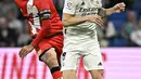 Dua gol kemenangan Los Blancos dilesakkan Karim Benzema dan Rodrygo. Sedangkan, gol balasan tim tamu dicetak Raul de Tomas. (JAVIER SORIANO / AFP)