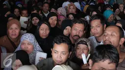 Ratusan TKI saat tiba di Bandara Soekarno Hatta,Tangerang, Rabu (11/11). Sebanyak 450 WNI overstayers dan TKI undocumented dari Jeddah, Arab Saudi dipulangkan pemerintah Indonesia untuk kembali ke kampung halaman. (Liputan6.com/Angga Yuniar)