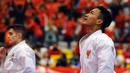 Ahmad Zigi Zaresta menengadah usai memastikan kemenangan di final Junior Kata Male di WKF World Junior, Cadet and U-21 Championship 2015 di ICE Serpong, Kamis (12/11/2015). Zigi menyumbang emas pertama bagi Indonesia. (Liputan6.com/Helmi Fithriansyah)