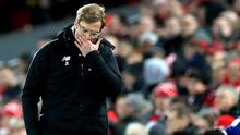 Pelatih Liverpool Jurgen Klopp tertunduk lesu usai pertandingan melawan West Bromwich Albion pada putaran keempat Piala FA di stadion Anfield, Inggris (27/1). Liverpool takluk dari West Bromwich Albion 3-2. (Peter Byrne / PA via AP)