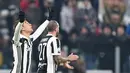 Pemain Juventus, Paulo Dybala berselebrasi setelah berhasil mencetak gol ke gawang Genoa pada laga 16 besar Coppa Italia 2017-2018 di Allianz Stadium, Rabu (20/12). Dybala menyumbang satu gol kemenangan Juventus 2-0. (Alessandro di Marco/ANSA via AP)