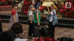 Sejumlah anak terlihat antusias menampilkan operet yang menceritakan kelahiran Yesus Kristus saat Misa Keluarga. (Liputan6.com/Angga Yuniar)