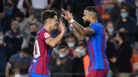 Memphis Depay (kanan) tampil baik saat Barcelona kalahkan Valencia pada pertandingan Liga Spanyol. (LLUIS GENE / AFP)