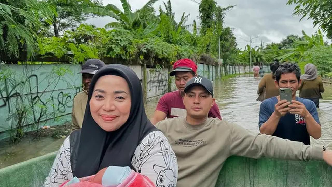 7 Potret Muzdalifah Ikut Suami Tinjau Banjir Tangerang, Bantu Evakuasi Bayi