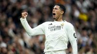 Ekspresi lega pemain Real Madrid, Jude Bellingham saat melakukan selebrasi setelah mencetak gol pertamanya pada musim ini dalam laga lanjutan Liga Spanyol 2024/2025 melawan Osasuna yang berlangsung di Santiago Bernabeu, Madrid, Spanyol, Sabtu (09/11/2024) WIB. (AP Photo/Jose Breton)