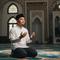 Ilustrasi Pria Mengamalkan Sholawat Jibril/Gemini AI