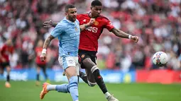 Manchester United mengalahkan sang rival Manchester City dengan skor 2-1. (JUSTIN TALLIS / AFP)