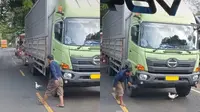 Seekor Itik main di kolong truk (TikTok/@nita_desi25)
