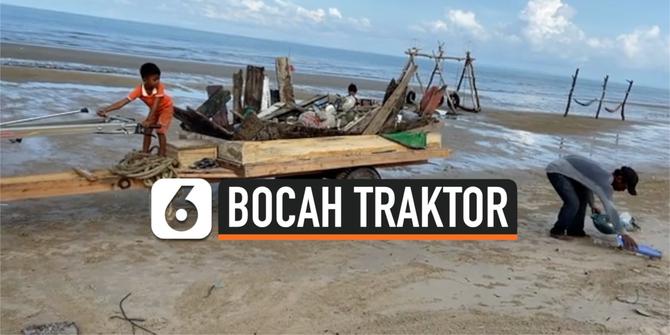 VIDEO: Aksi Bocah Pengendara Traktor Bersihkan Sampah di Pantai