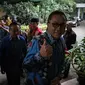 Ketum PAN, Zulkifli Hasan menyapa awak media saat tiba di kediaman Megawati di Jalan Teuku Umar, Jakarta, Selasa (22/11). Pertemuan tertutup tersebut membahas situasi politik terkini dan pilkada serentak 2017. (Liputan6.com/Faizal Fanani)