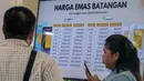 Harga emas Antam hari ini, Senin (14/4/2025), mengalami penurunan tipis. Harga emas per gram dijual Rp1.896.000 atau turun Rp 8.000 dibanding kemarin, Minggu (13/4/2025) yang berada di level Rp1.904.000 per gram. (BAY ISMOYO/AFP)