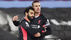 Penyerang Liverpool, Mohamed Salah, melakukan selebrasi bersama Jordan Henderson usai mencetak gol ke gawang West Ham United pada laga Liga Inggris di Stadion London, Minggu (31/1/2021). Liverpool menang dengan skor 3-1. (Justin Setterfield/Pool via AP)
