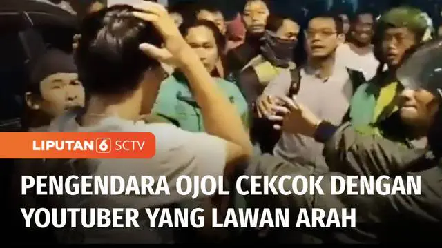 Puluhan warga dan pengemudi ojek online terlibat kericuhan dengan tim pembuat konten atau Youtuber, yang melarang para pengendara melawan arah di kawasan Tebet, Jakarta Selatan. Bahkan salah satu tim Youtuber yang diduga sempat mencekik pengendara se...