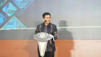 Direktur Utama BPJS Kesehatan, Ghufron Mukti memberikan sambutan dalam acara peringatan International Universal Health Coverage (UHC) Day, Selasa (12/12).