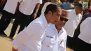 Presiden Joko Widodo (Jokowi) didampingi Gubernur Rusli Habibie melakukan panen raya jagung di Desa Botuwombato, Kabupaten Gorontalo Utara, Jumat (1/3). Jokowi melakukan panen raya jagung seluas 1.392 hektare. (Liputan6.com/Arfandi Ibrahim)