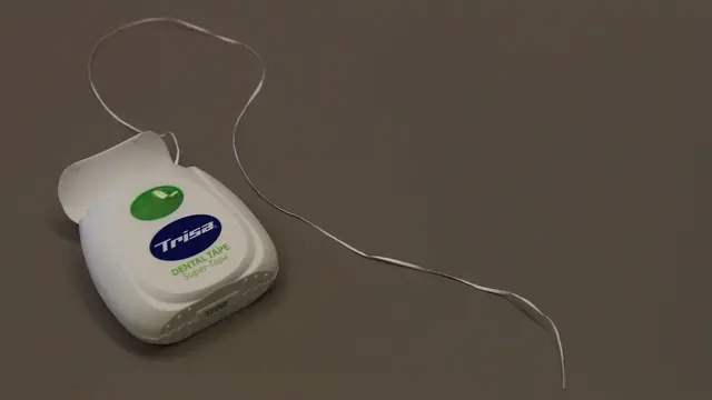 Ilustrasi flossing gigi