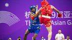 Cabang wushu kembali menambah perbendaharaan medali Kontingen Indonesia pada ajang Asian Games 2022, Kamis (28/9/2023). Adalah Samuel Marbun yang berlaga di nomor sanda kelas 65kg putra yang memastikan merebut medali perak setelah kalah dari atlet asal Iran, Afsin Shalimi Toupghara dalam laga final yang digelar di Xiaoshan Guali Sports Centre, Hangzhou, China. Hasil ini tergolong luar biasa bagi atlet asal Sumatera Utara tersebut yang menjalani debutnya di Asian Games Hangzhou 2022. (NOC Indonesia/Naif Al'as)