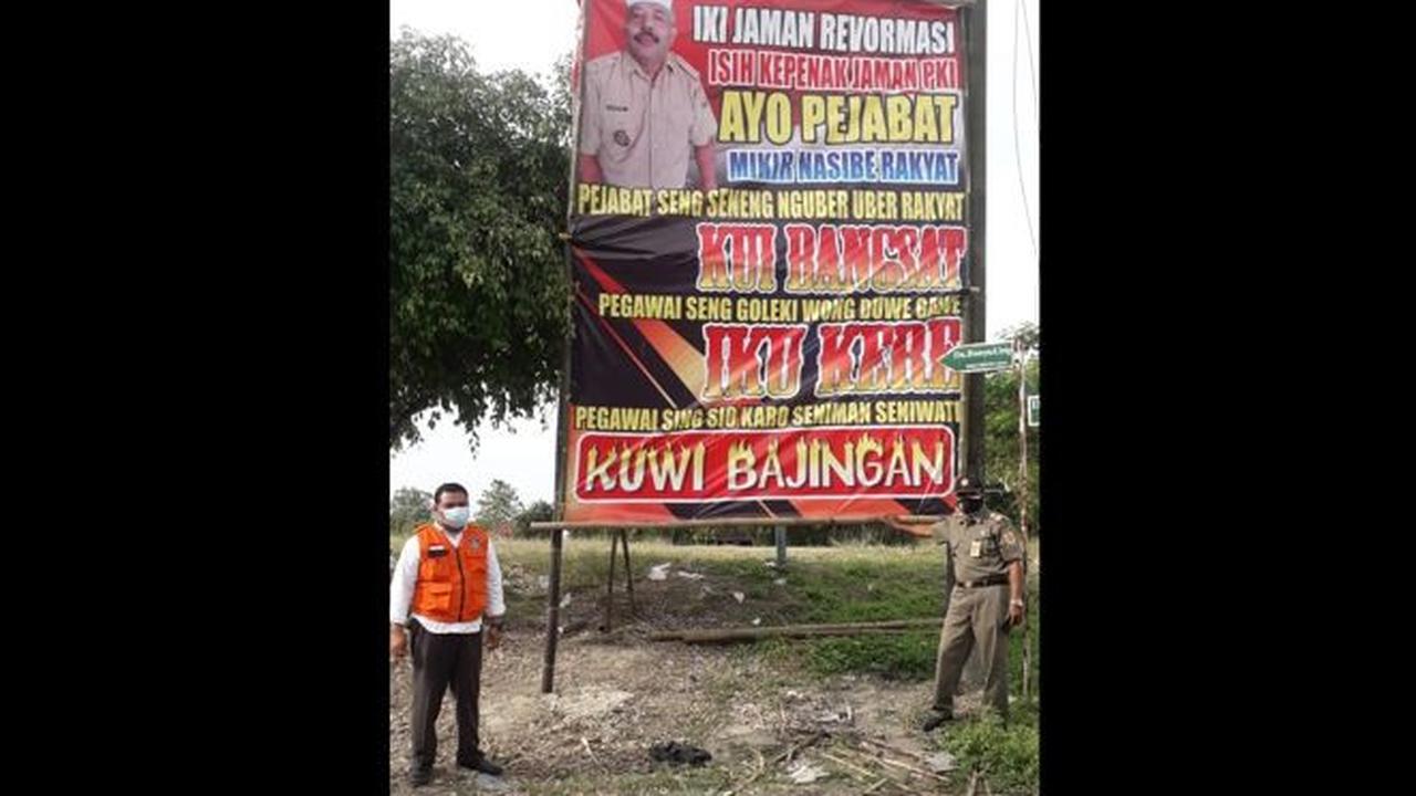 Baliho berisi cacian dan makian kepada pemerintah dipasang Kades Jenar, Samto, pada Rabu (14/7/2021). Baliho itu dibongkar Tim Satgas Penanggulangan Covid-19 Kecamatan Jenar, Sragen, hari itu juga. (Solopos.com/Istimewa/Kardiyono)