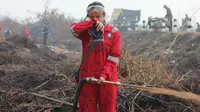 Intan saat bertugas memadamkan api di lahan gambut Kabupaten Pulang Pisau, Kalteng. (Ist)