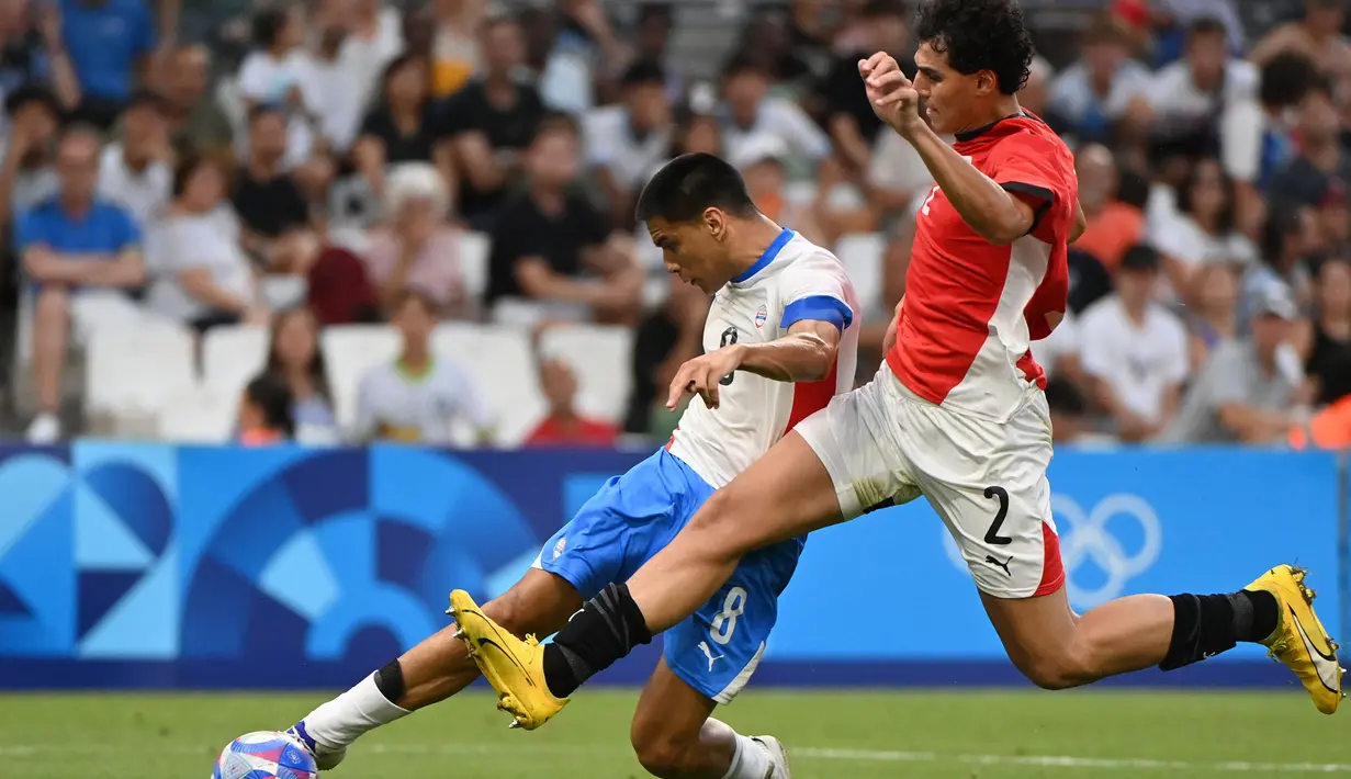 Paraguay membuka peluang kemenangan setelah berhasil menjebol gawang Mesir di menit ke-71 lewat aksi Diego Gomez. (Sylvain THOMAS/AFP)