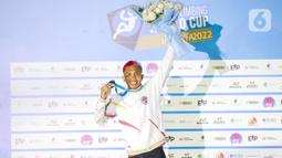 Atlet panjat tebing Indonesia Aspar Jailolo saat meraih juara kategori speed dalam Kejuaran Dunia Panjat Tebing 2022 (International Federation of Sport Climbing/IFSC) di Jakarta, Sabtu (24/9/2022). Aspar berhasil mengalahkan lawan yang juga kompatriotnya, Kiromal Katibin. Catatan waktu Aspar adalah 5,39 detik. (Liputan6.com/Faizal Fanani)