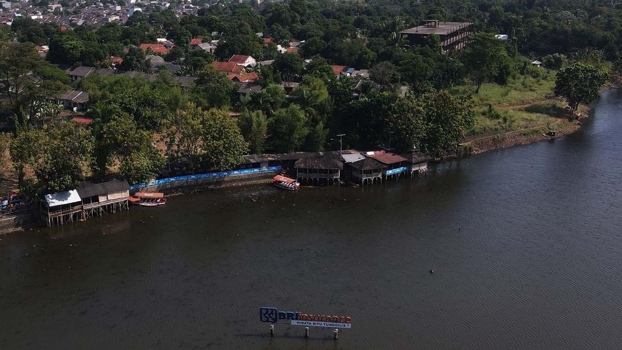 Bicara wisata alam di Kabupaten Bogor, Jawa Barat, memang tak ada habisnya. Tak hanya air terjun, Kabupaten Bogor juga memiliki danau yang tak kalah indah. Yakni, Situ Tunggilis. Foto: Merdeka.com/Imam Buhori