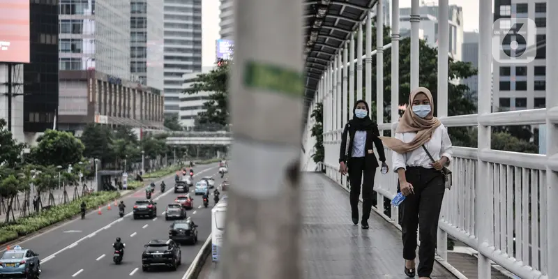 FOTO: Pembatasan 25 Persen Pekerja Kantoran