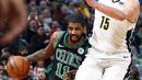 Pemain Boston Celtics, Kyrie Irving (kiri) berusaha melewati adangan pemain Denver Nuggets, Nikola Jokic pada laga NBA basketball game di Pepsi Center, Denver, (29/1/2018). Celtics menang 111-110. (AP/David Zalubowski)