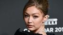 Model AS Gigi Hadid berpose menjelang peluncuran Kalender Pirelli 2019 di Pirelli HangarBicocca di Milan (5/12). Gigi Hadid merupakan salah satu model yang muncul di Kalender Pirelli 2019. (AFP Photo/Miguel Medina)