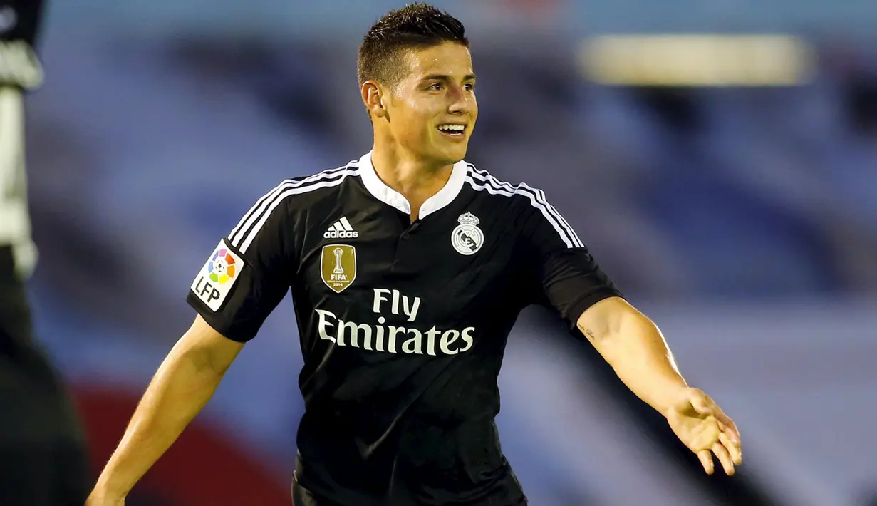 Penyerang Real Madrid, James Rodriguez merayakan selebrasi usai mencetak gol ke gawang Celta Vigo pada laga Liga Spanyol di Stadion Balaidos , Spanyol, Senin (27/4/2015). Real Madrid menang 4-2 atas Celta Vigo. (REUTERS/Miguel Vidal)