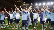 Pemain Burnley merayakan keberhasilan mereka promosi ke Premier League musim depan setelah menang atas Middelsbrough di Riverside Stadium, Jumat (7/4/2023). Tim asuhan mantan kapten Man City, Vincent Kompany, itu menjadi tim pertama yang memastikan diri promosi ke Premier League musim depan. (Richard Sellers/PA via AP)