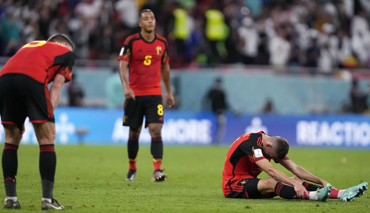 <p>Belgia pun dipastikan tersingkir dari Piala Dunia 2022 setalah pada laga yang bersamaan Maroko berhasil mengalahkan Kanada dengan sko 2-1. (AP/Thanassis Stavrakis)</p>