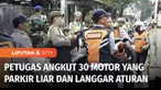 Petugas gabungan menggelar razia parkir liar kendaraan yang merupakan bagian dari Operasi Patuh Jaya 2024. Puluhan sepeda motor terjaring razia di depan rumah sakit di Kalideres, Jakarta Barat.