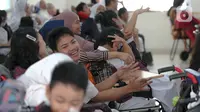 Sejumlah siswa saat hari pertama masuk sekolah di SLB Yayasan Pembinaan Anak Cacat (YPAC) , Jakarta, Senin (8/7/2024). (Liputan6.com/Herman Zakharia)