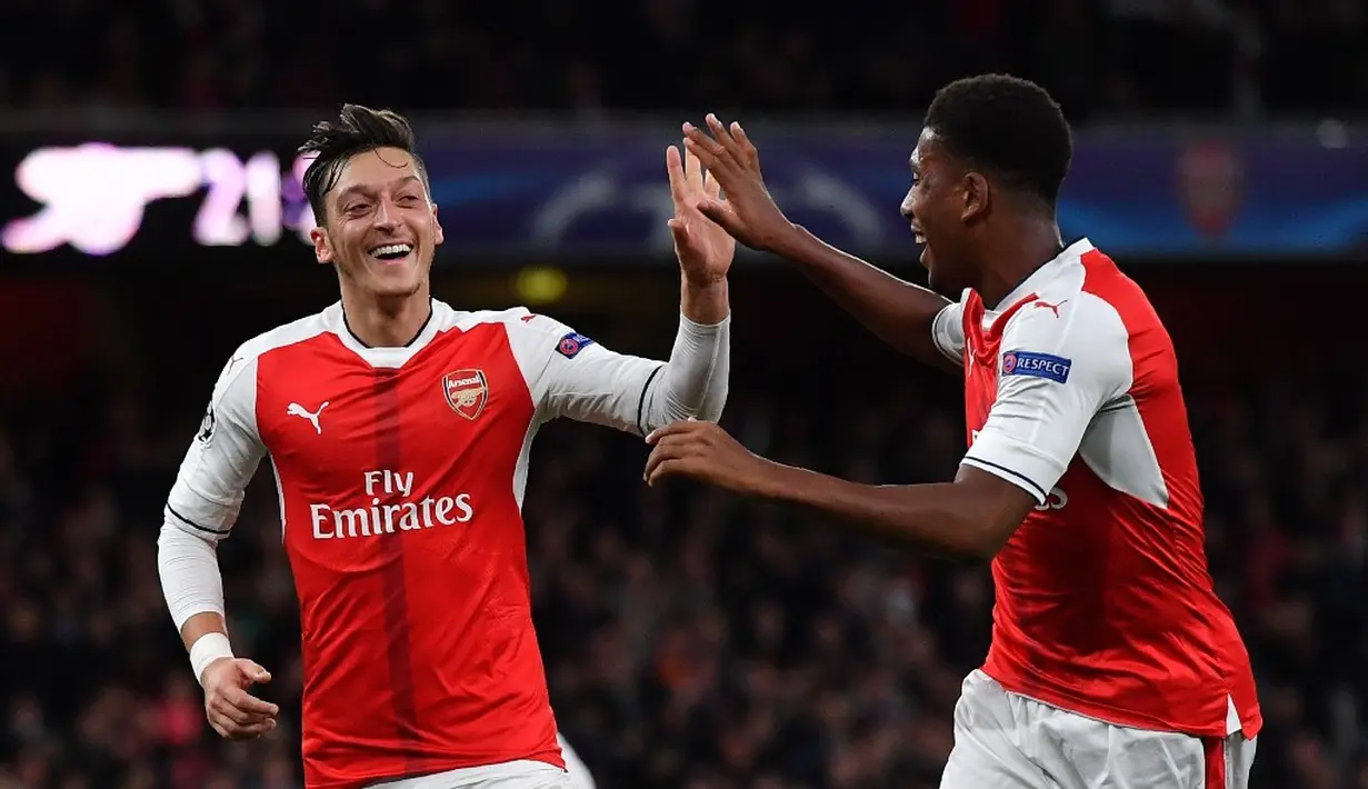 Ekspresi pemain Arsenal, Alex Oxlade-Chamberlain, setelah mencetak hattrick ke gawang Ludogorets dalam laga Grup A Liga Champions di Stadion Emirates, Kamis (20/10/2016) dini hari WIB. (AFP/Ben Stansall)