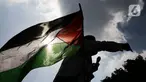 Massa Gerakan Pekerja Muslim Indonesia (GPMI) melakukan aksi solidaritas untuk Palestina di kawasan Thamrin Jakarta, Jumat (28/5/2021). Mereka menyuarakan keprihatinan atas tragedi kemanusiaan di Palestina, serta mewujudkan perdamaian dunia dan kemerdekaan atas Palestina (Liputan6.com/Faizal Fanani)