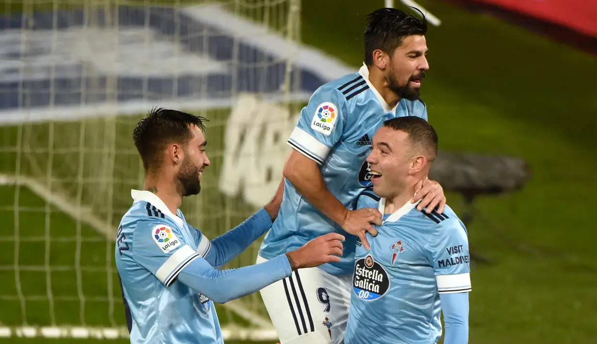 Penyerang Celta Vigo, Iago Aspas, merayakan gol yang dicetaknya ke gawang Cadiz pada laga lanjutan Liga Spanyol di Stadion Abanca Balaidos, Selasa (15/12/2020) dini hari WIB. Celta Vigo menang telak 4-0 atas Cadiz. (AFP/Miguel Riopa)