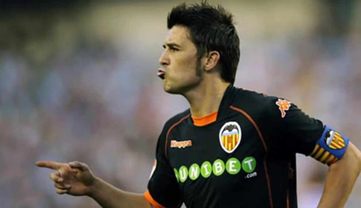 Gaya striker Valencia, David Villa seusai mencetak gol ke gawang Real Valladolid dalam lanjutan La Liga yang berlangsung di Jose Zorrilla Stadium, 13 September 2009. Valencia unggul 4-2. AFP PHOTO/Pedro ARMESTRE. 