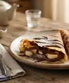Resep Kue Leker Teflon dengan Isian Pisang dan Cokelat (AI Generated)