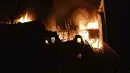 Dan menyebabkan kebakaran yang melanda area seluas 450 meter persegi (4.800 kaki persegi) dan terbakar selama berjam-jam. (Ukrainian Emergency Service via AP)