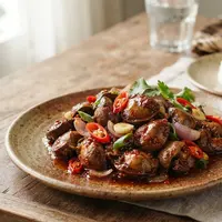 Resep Bumbu Tumis Ati Ampela Ayam, Temukan Tips agar Hasilnya Empuk dan Tidak Alot. (AI Generated)