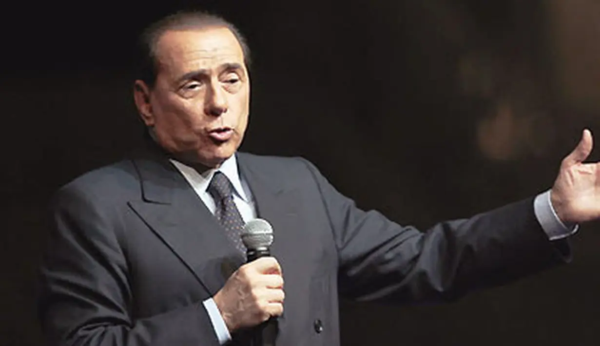 Italian Prime Minister Silvio Berlusconi delivers a speech during the "Festa della Liberta" (The freedom festival) organised by his party "Il popolo della Liberta" (the people of freedom) on October 5, 2008, in Milan. AFP PHOTO/Emilio 