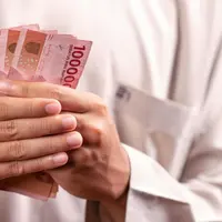 Ilustrasi uang rupiah, bansos. (Photo by Defrino Maasy)