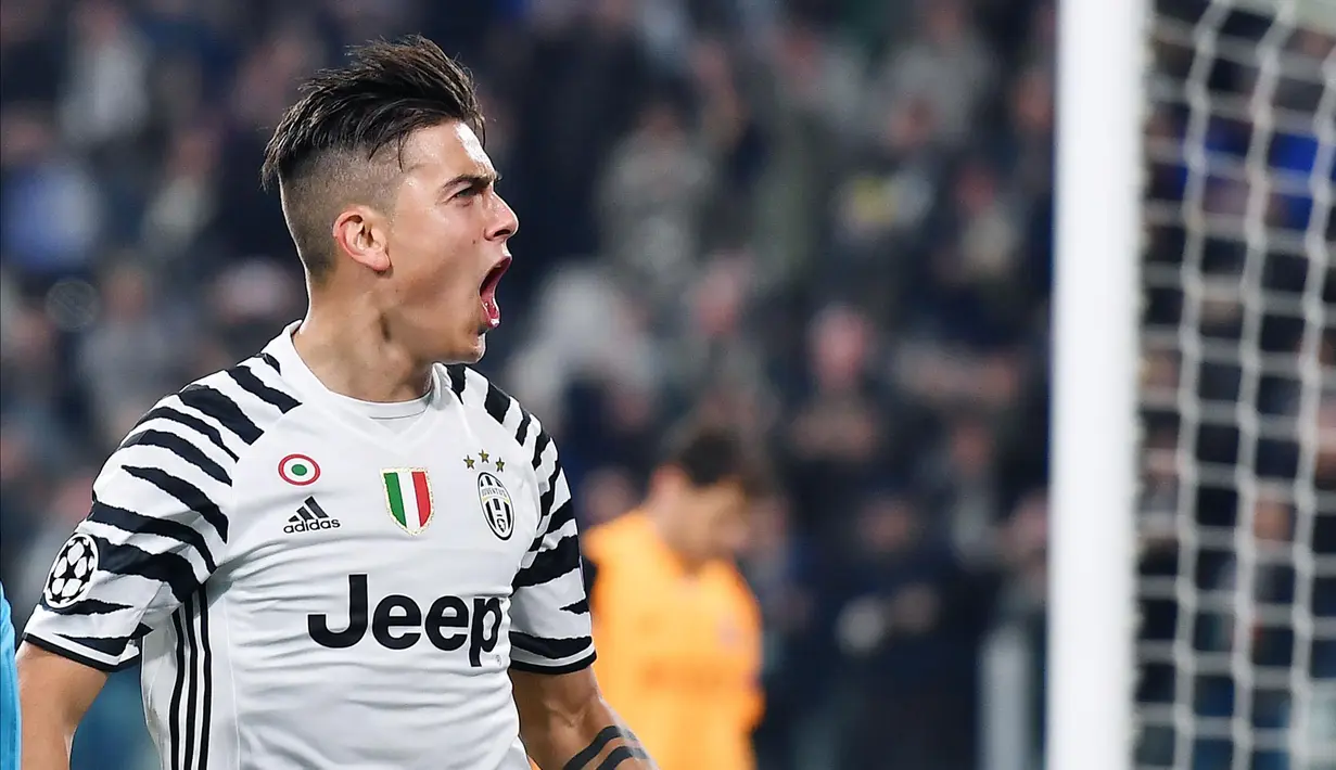 Penyerang Juventus, Paulo Dybala melakukan selebrasi usai mencetak gol ke gawang Porto pada leg kedua babak 16 besar Liga Champions di Stadion Juventus, Turin, Italia, (15/3). Juventus menang atas Porto dengan skor 1-0. (Alessandro Di Marco/ANSA via AP)