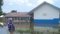 Hujan lebat di Palembang picu banjir hingga menewaskan bocah (Liputan6.com / Nefri Inge)