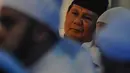 Calon presiden nomor urut 02 Prabowo Subianto saat menghadiri Maulid Nabi sekaligus haul Habib Ali bin Abdurrahman Al-Habsyi Kwitang di Kwitang, Jakarta, Kamis (6/12). (Liputan6.com/Faizal Fanani)