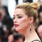 Aktris AS Amber Heard saat tiba pemutaran film "Sorry Angel (Plaire, Aimer et Courir Vite)" pada Festival Film Cannes ke-71 di Cannes, Prancis (10/5). Amber Heard tampil mengenakan gaun bermotif bunga. (AFP Photo/Loic Venance)