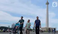 Selama momen libur Lebaran 2025 kawasan Monumen Nasional dibuka untuk umum mulai pukul 06.00 hingga 22.00 WIB. (Liputan6.com/Herman Zakharia)
